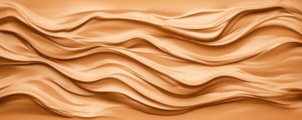 Obraz premium A textured, wavy surface in warm beige tones, resembling flowing fabric or clay, creating a dynamic and artistic visual.