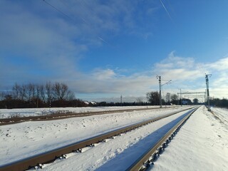 Two way railroad tracks in countryside. Two railway tracks. Sunny day. Countryside. Fields and...