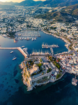 Aerial view of Bodrum castle and marina with boats along the beautiful coastline, Bodrum, Turkey.
