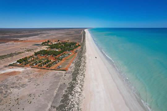 Aerial view of eighty mile beach with serene ocean and scenic coastline, Kimberley Region, Australia.