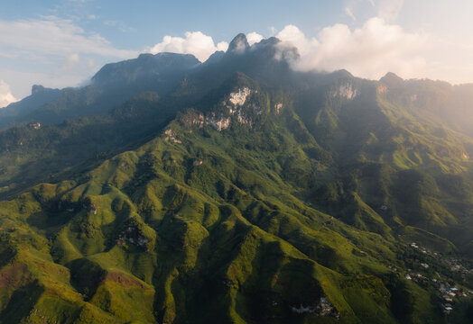Aerial view of majestic mountains and tranquil mountain valley with lush ridges, Du Gia, Yen Minh, Ha Giang, Vietnam.