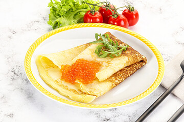 Russian pancake with red caviar