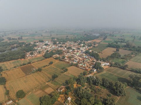 Aerial view of serene rural village with farmland and greenery, Bharhkol, Fatehpur Sikri, Uttar Pradesh, India.
