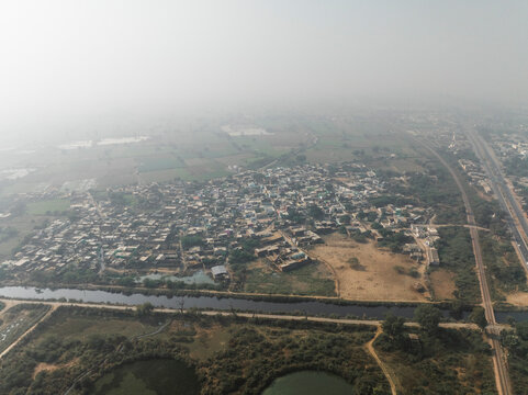 Aerial view of beautiful village landscape with houses, roads, and fields, Fatehpur Sikri, India.
