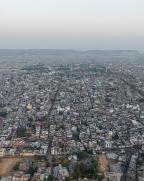 Aerial view of dense residential buildings and streets in a vibrant cityscape, Subhash Nagar, Jaipur, India.