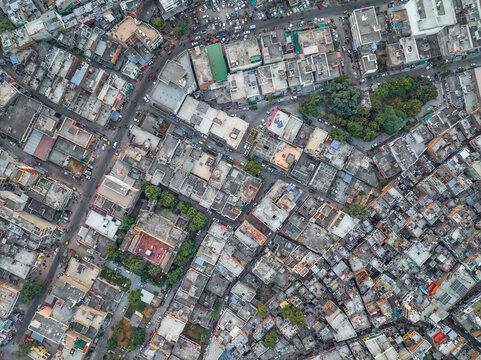 Aerial view of vibrant and bustling cityscape with colorful buildings and greenery, Subhash Nagar, Jaipur, India.