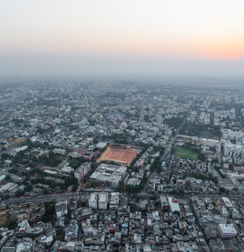 Aerial view of beautiful cityscape and skyline at sunset with dense residential sprawl, Subhash Nagar, Jaipur, Rajasthan, India.