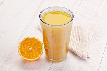 Sweet fresh orange juice in the glass