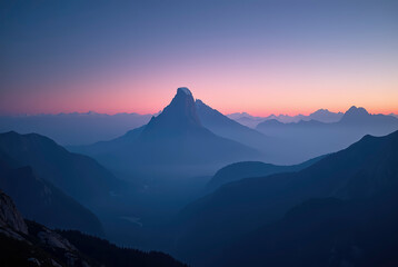 A view of the mountain at dusk with a dark sky