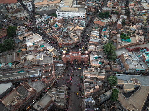 Aerial view of bustling Kote Gate with vibrant streets and historic buildings, Bikaner, India.
