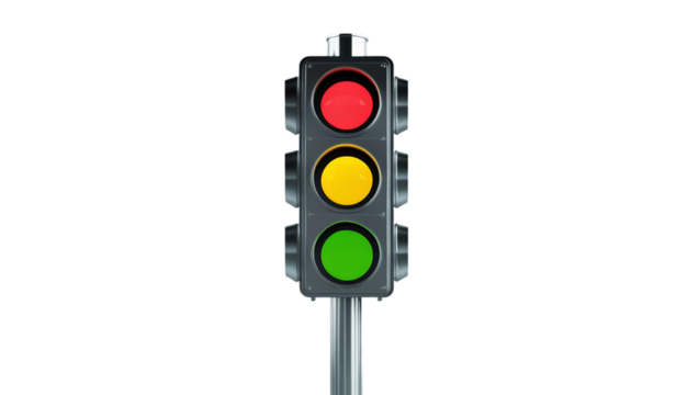 A classic traffic light featuring red, yellow, and green lights, signaling vehicle movement and safety, mounted on a sturdy pole, representing order in road systems