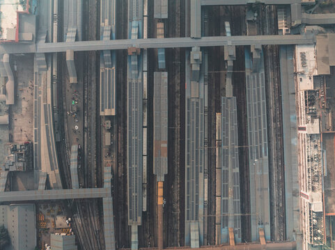 Aerial view of busy Ajmeri Gate train station with railway tracks and platforms, New Delhi, India.