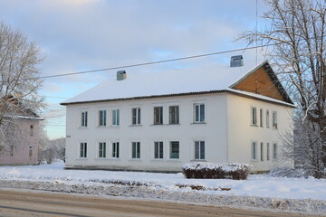 A Beautiful SnowCovered White Building Set in a Serene Winter Landscape and Scene