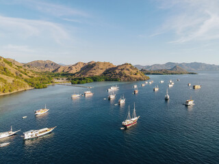 Aerial view of the beauty of Labuan Bajo is filled with a collection of traditional boats Pinisi.