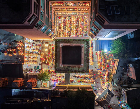 Aerial view of the vibrant Kartik Vrata festival with illuminated temples and a large crowd, Gendaria, Dhaka, Bangladesh.