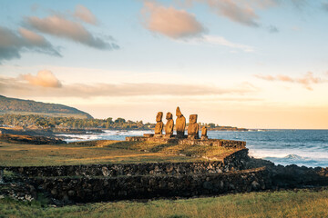 Ahu Vai Uri at Tahai archeological complex on Easter Island (Rapa Nui), Chile, featuring five restored moai that were originally carved in different styles. Ahu's construction dates back to 1200 AD.