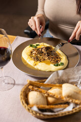 Woman eating dinner in the retaurant