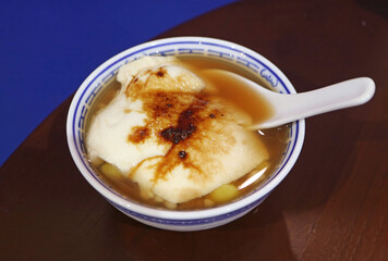 Delectable Chinese Soybean Pudding Called Douhua in Hot Ginger Syrup