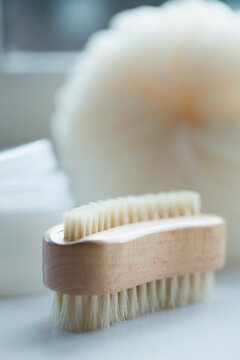 Close up of a wooden fingernail brush
