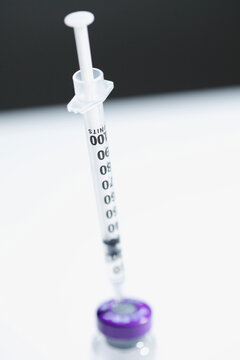 Hypodermic Needle Inserted in Medicine Vial
