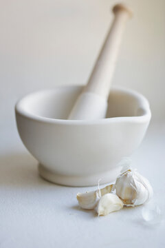 Mortar and Pestle with Garlic Cloves
