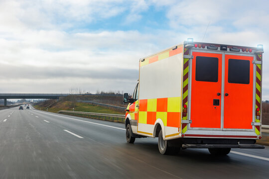 German Ambulance EMS eu uk paramedic rescue van transport rushing drive Europe highway road suburb neighborhood sunny day rain. Medical urgent service help vehicle. First aid traffic accident support