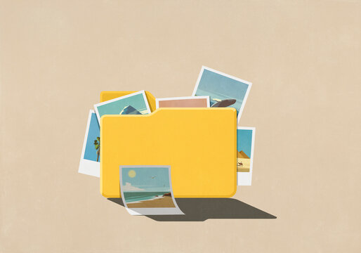 Travel photos spilling from digital file folder on beige background
