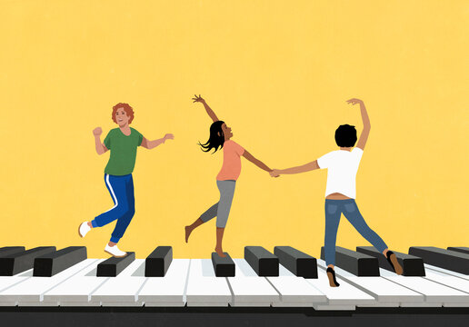 Happy young friends dancing on large piano against yellow background
