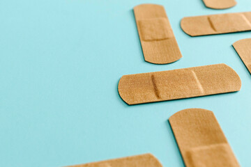 Brown Band Aids On Blue Surface