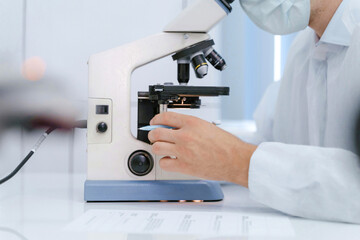 Medical Professional using Microscope