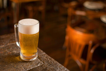 a cold pint of beer on a pub table