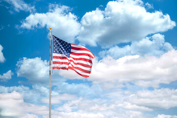 United States of America flag waving on a blue and sunny sky