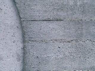 Detail of concrete wall with a curve in left side