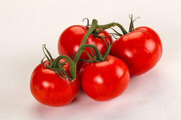 Ripe fresh tomato on the branch
