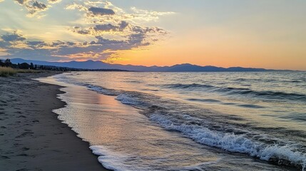 Serene Sunset Over Calm Water at Beach with Gentle Waves