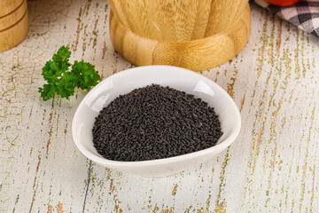 Black dry Nigella seeds in the bowl