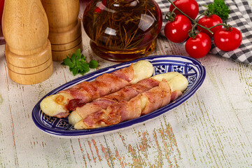 Hot mozzarella sticks with bacon
