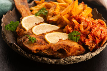 Breaded flounder with fries and kimchi