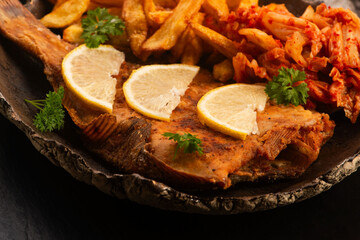 Breaded flounder with fries and kimchi