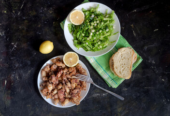 Fried calamari on a wooden table