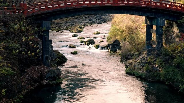 A stunning view of the historic Shinkyo Bridge in Nikko at Autumn, Japan.