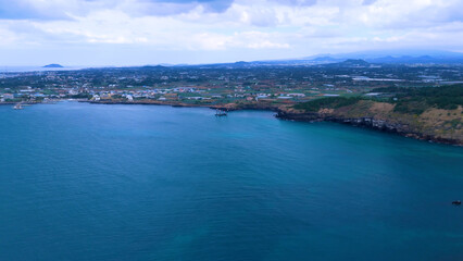 The beautiful island, Chagwido Island, and Wawa of Jeju Island in Korea are taken with drones from the sky, the sea, waves, and beautiful nature