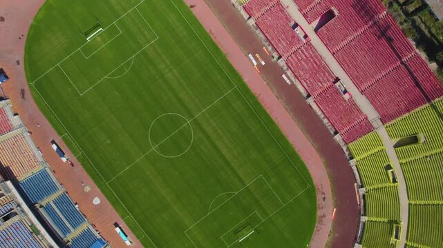 Ramat Gan Stadium, This aerial top-down view of the empty seats echoes the historic moments when the stadium was filled with cheering crowds, highlights its expansive architecture