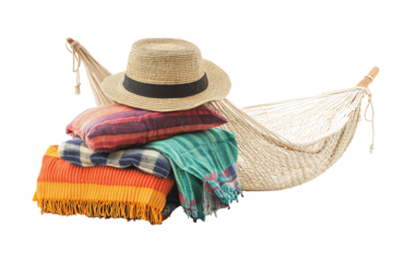 A cozy hammock set with colorful blankets and a straw hat, perfect for relaxation in a sunny environment. Ideal for summer vibes.
