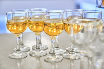 Wine glasses in a row. Festive buffet with wine tasting. The concept of holidays and entertainment. With space to copy. High quality photo