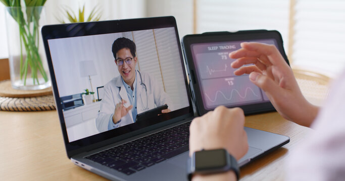 Asia people young woman video call talk chat help guide online at home by AI tele consult telehealth telemedicine app clinic in IoT device collect ECG data heart pulse sleep rate on cloud computing.