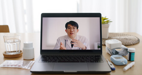 Closeup asia sick people patient video call virtual clinic visit health care talk online on tele consult telemedicine telehealth app GP man help chat teach to use medic tools blood sugar test at home.