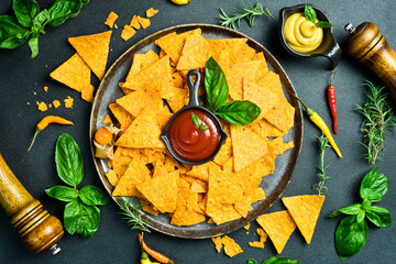Mexican tortilla nacho crisps with tomato sauce and chili pepper. Tortilla chips. Corn chips. Top view.