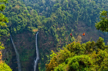 Zipline flights. Tad Fane waterfall in rainforest at Pakse and Champasak city Laos. Tour tourism and travel in Asia. Beautiful and largest park with cascades of waterfalls in Laos