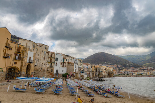 CEFALU', ITALY, JUNE 17, 2023 - The beach of Cefalù, province of Palermo, Sicily, Italy - Powered by Adobe